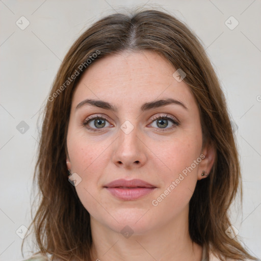 Joyful white young-adult female with medium  brown hair and green eyes