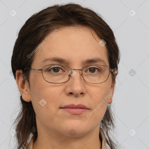 Joyful white adult female with medium  brown hair and brown eyes