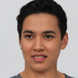 Joyful asian young-adult male with short  black hair and brown eyes