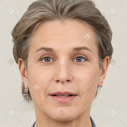 Joyful white adult female with short  brown hair and grey eyes