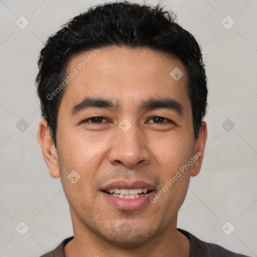 Joyful white young-adult male with short  black hair and brown eyes