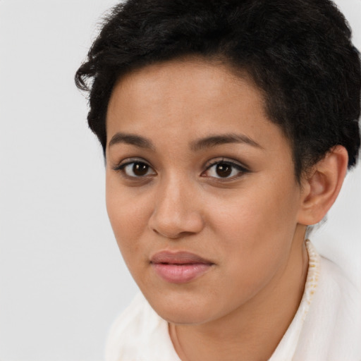 Joyful latino young-adult female with short  brown hair and brown eyes