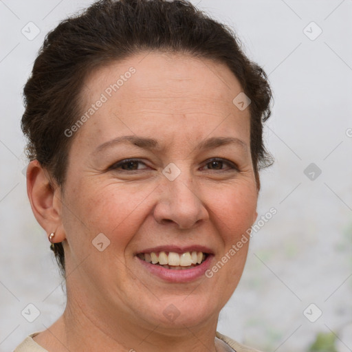 Joyful white adult female with short  brown hair and brown eyes