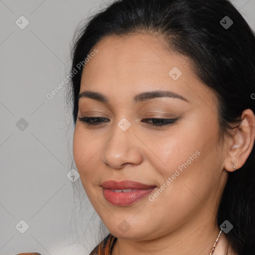 Joyful latino young-adult female with long  brown hair and brown eyes