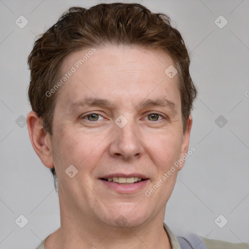 Joyful white adult male with short  brown hair and grey eyes