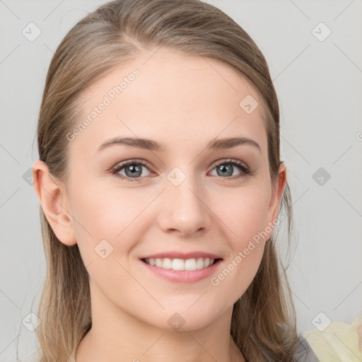 Joyful white young-adult female with long  brown hair and grey eyes