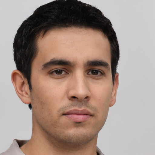 Neutral latino young-adult male with short  black hair and brown eyes