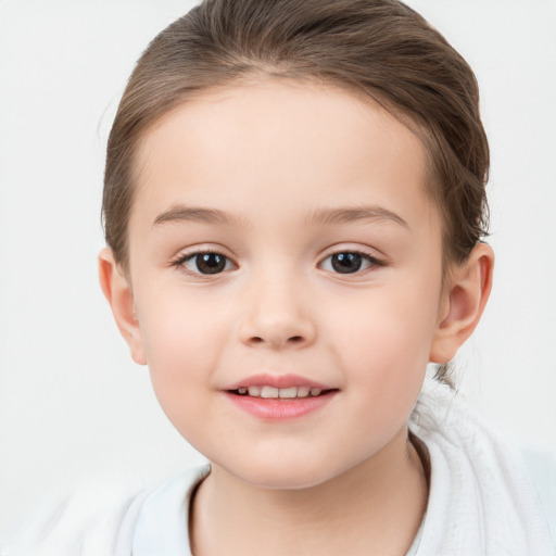 Joyful white child female with short  brown hair and brown eyes