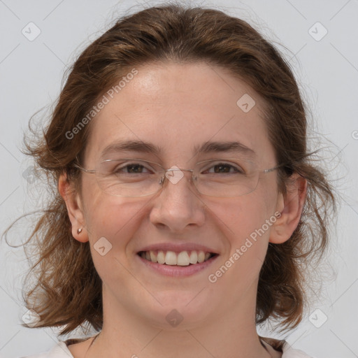 Joyful white adult female with medium  brown hair and brown eyes