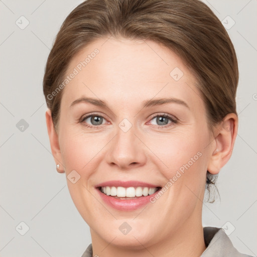 Joyful white young-adult female with short  brown hair and grey eyes