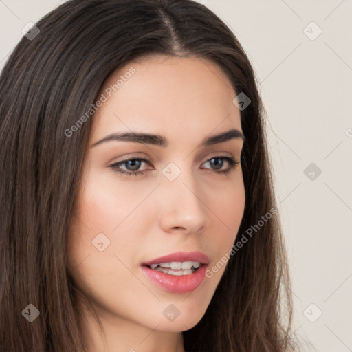 Neutral white young-adult female with long  brown hair and brown eyes