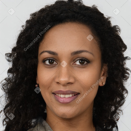 Joyful black young-adult female with long  brown hair and brown eyes