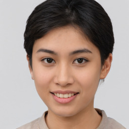 Joyful asian young-adult female with short  brown hair and brown eyes