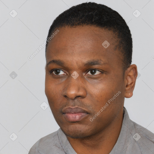 Neutral black young-adult male with short  black hair and brown eyes