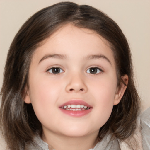 Joyful white child female with medium  brown hair and brown eyes