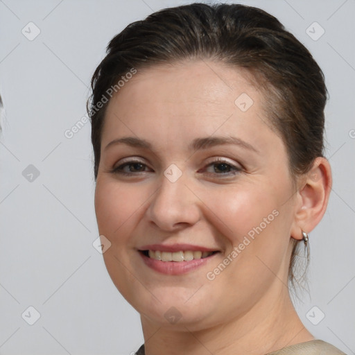 Joyful white young-adult female with medium  brown hair and brown eyes