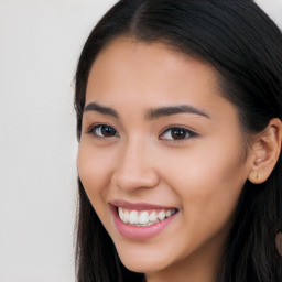 Joyful latino young-adult female with long  black hair and brown eyes