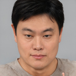 Neutral asian young-adult male with short  brown hair and brown eyes