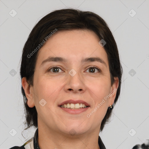 Joyful white adult female with medium  brown hair and brown eyes