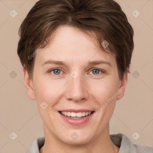 Joyful white adult female with short  brown hair and grey eyes