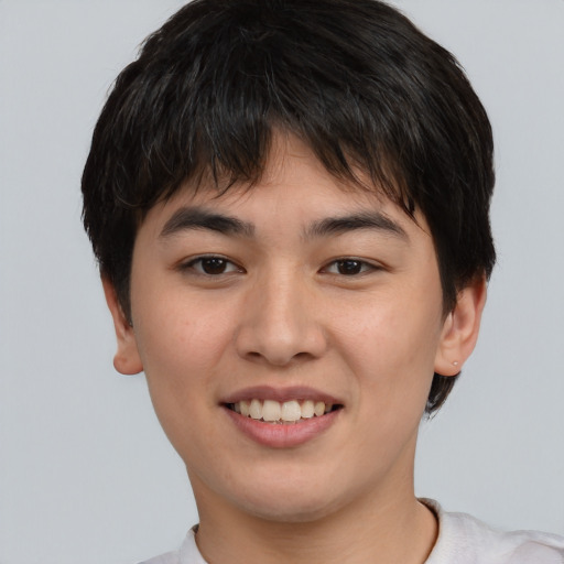 Joyful asian young-adult female with short  brown hair and brown eyes