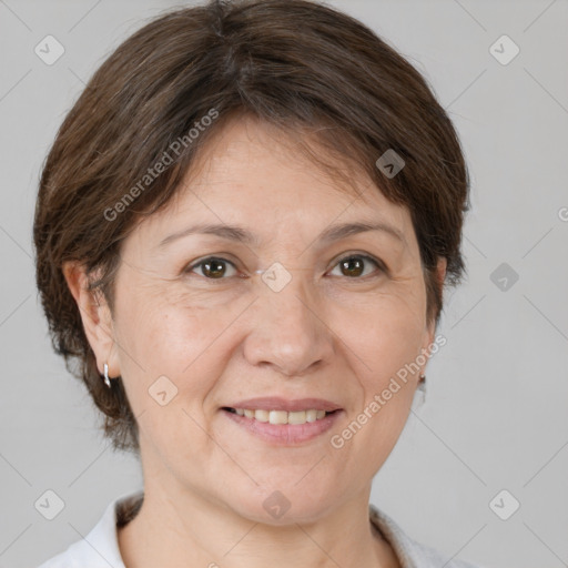 Joyful white adult female with short  brown hair and brown eyes