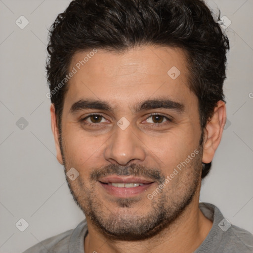 Joyful white young-adult male with short  black hair and brown eyes