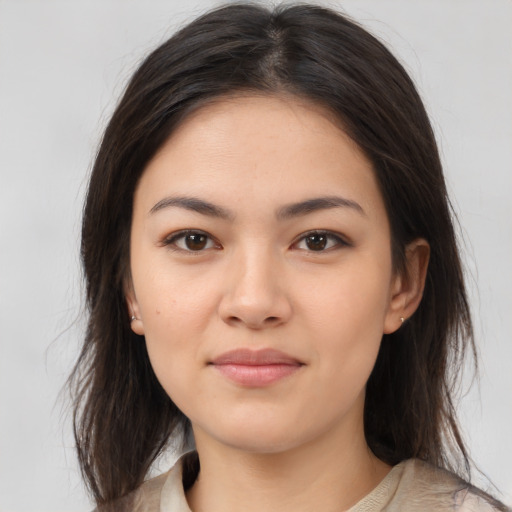 Neutral asian young-adult female with medium  brown hair and brown eyes