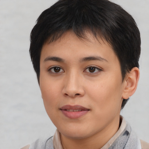 Joyful asian young-adult female with short  brown hair and brown eyes
