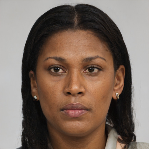 Neutral black young-adult female with medium  brown hair and brown eyes