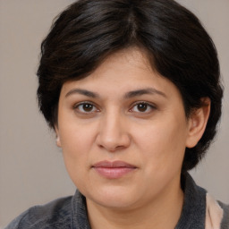 Joyful white adult female with medium  brown hair and brown eyes