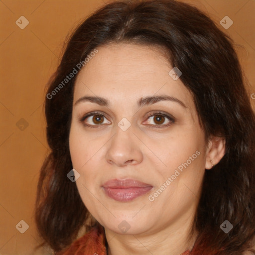 Joyful white adult female with medium  brown hair and brown eyes