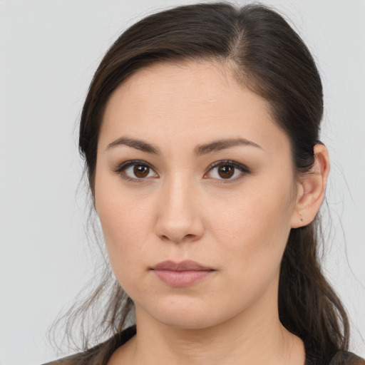 Neutral white young-adult female with long  brown hair and brown eyes