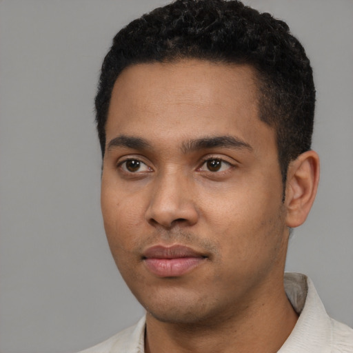 Neutral latino young-adult male with short  black hair and brown eyes