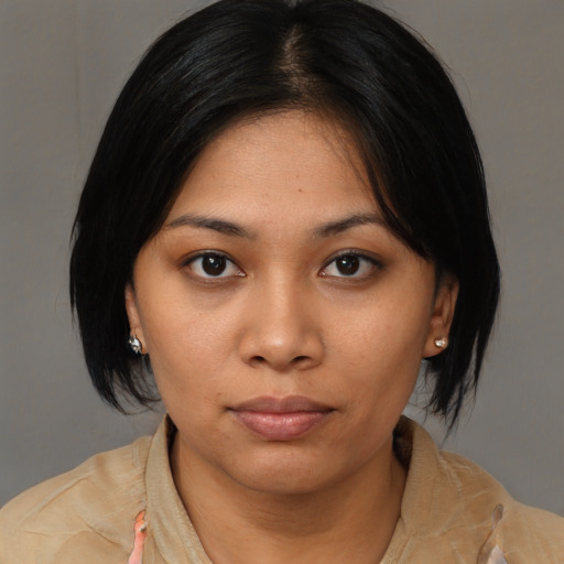 Neutral asian young-adult female with medium  black hair and brown eyes