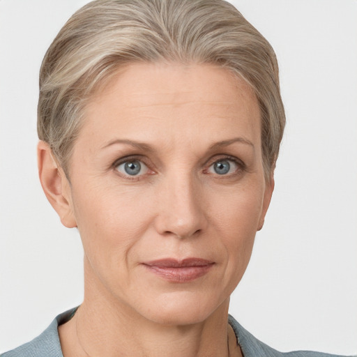 Joyful white adult female with short  brown hair and grey eyes