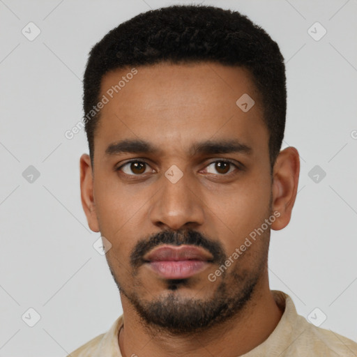 Neutral latino young-adult male with short  black hair and brown eyes