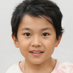 Joyful asian child female with short  brown hair and brown eyes