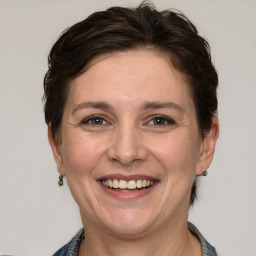 Joyful white adult female with short  brown hair and brown eyes