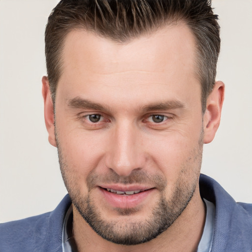 Joyful white young-adult male with short  brown hair and brown eyes