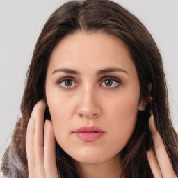 Neutral white young-adult female with long  brown hair and brown eyes