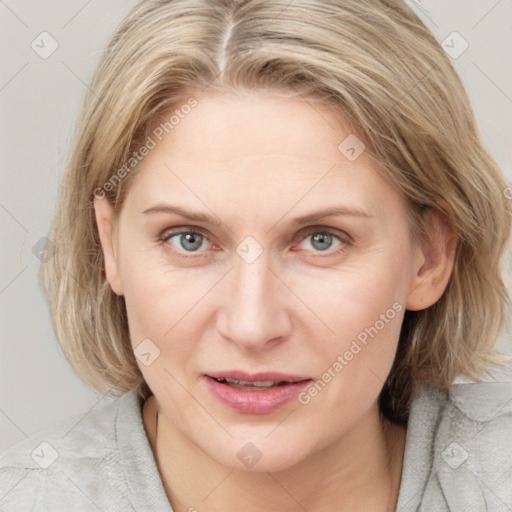 Joyful white young-adult female with medium  brown hair and blue eyes