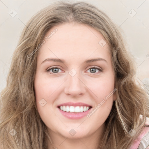 Joyful white young-adult female with long  brown hair and green eyes