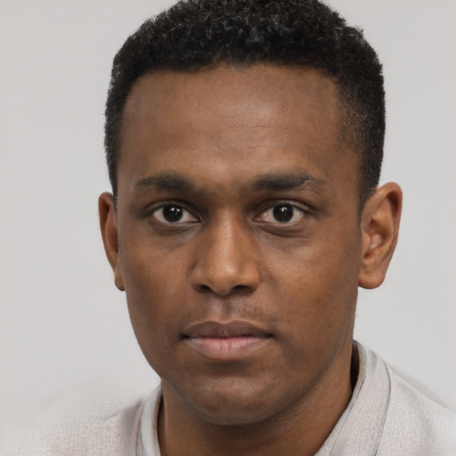 Neutral black young-adult male with short  black hair and brown eyes
