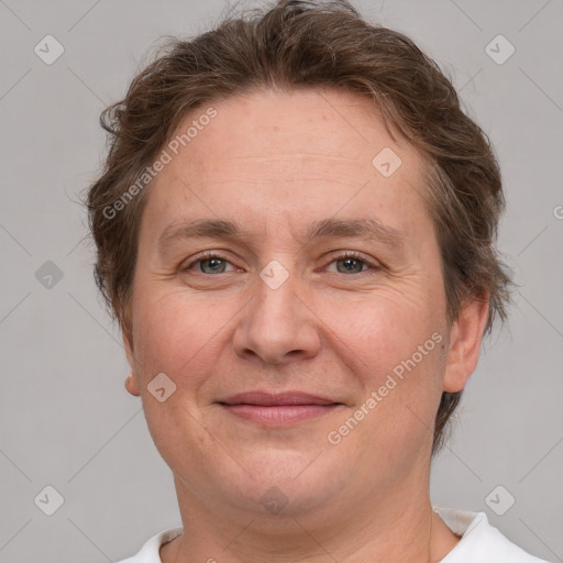 Joyful white adult female with short  brown hair and grey eyes