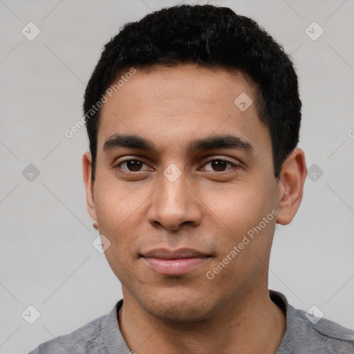 Neutral latino young-adult male with short  black hair and brown eyes