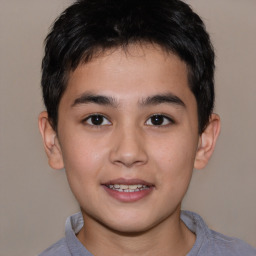 Joyful white child male with short  brown hair and brown eyes