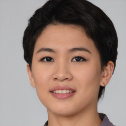 Joyful asian young-adult female with short  black hair and brown eyes