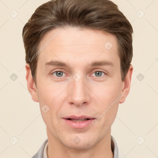 Joyful white adult male with short  brown hair and grey eyes