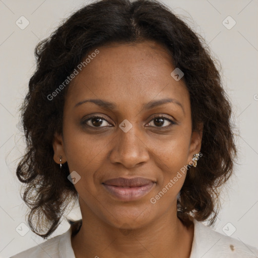 Joyful black adult female with medium  brown hair and brown eyes
